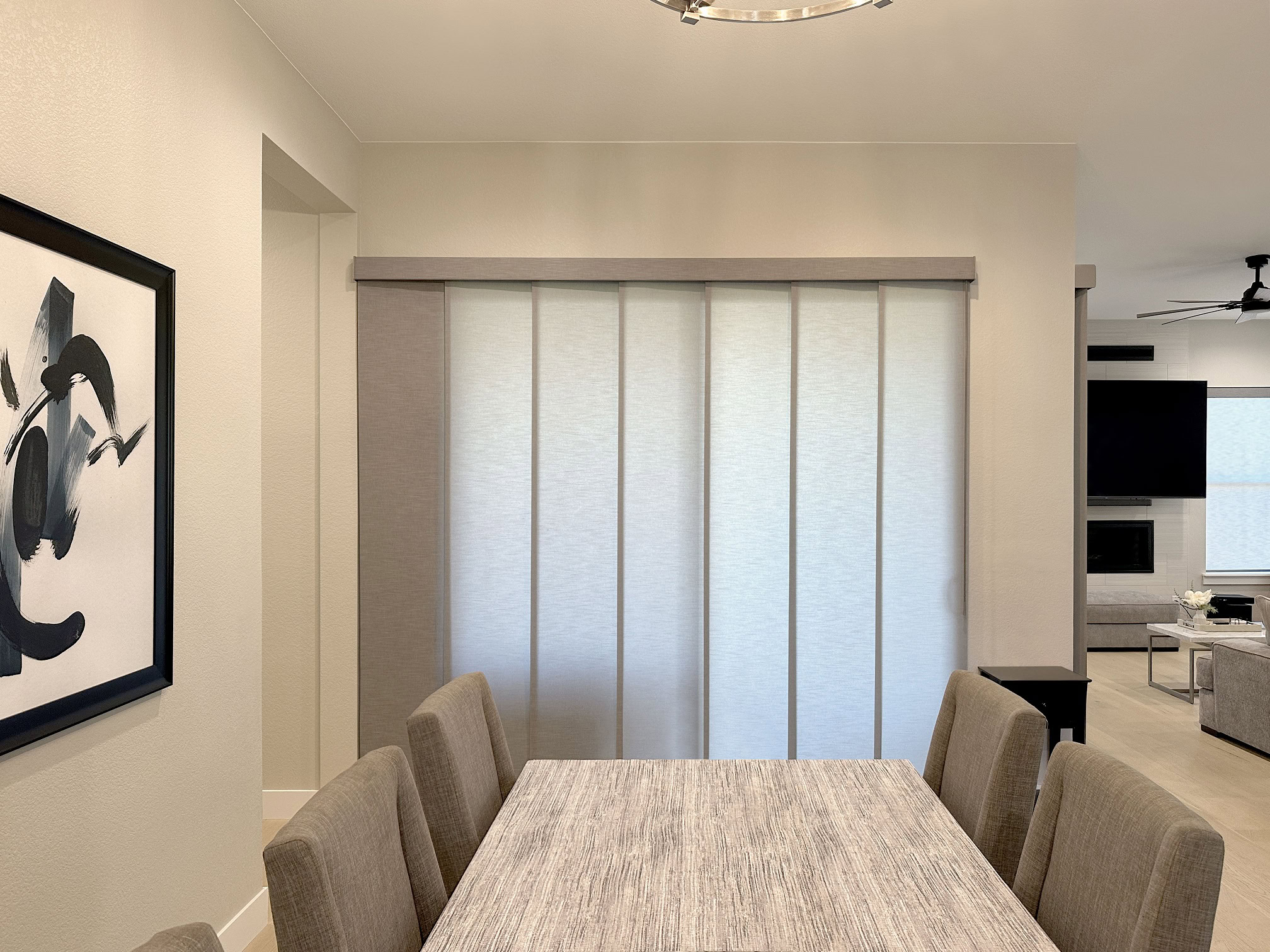 Hunter Douglas Skyline Panel-Track Blinds with wand control, left stack vertical design, and light filtering fabric