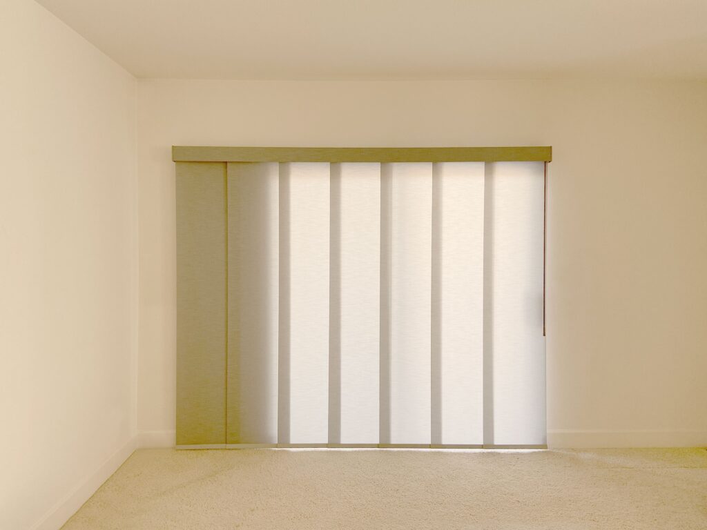 Vertical blinds for light control and privacy in living spaces.