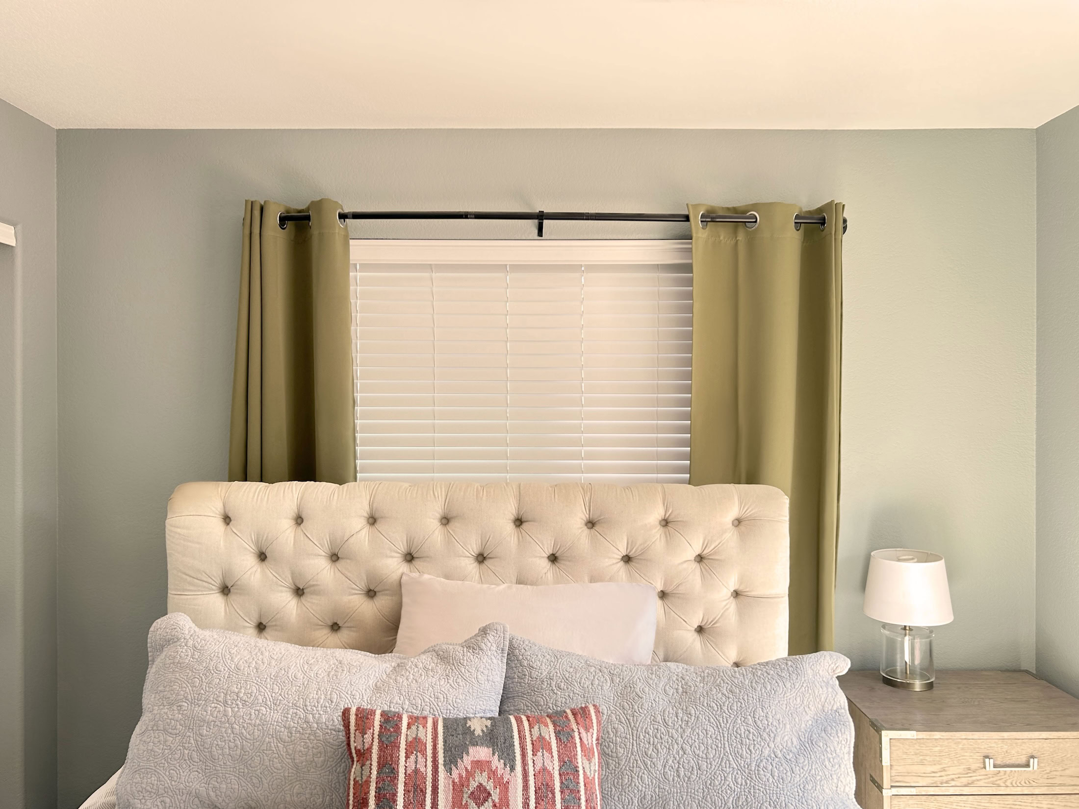 Custom window curtains in Lakewood enhancing bedroom decor and privacy.