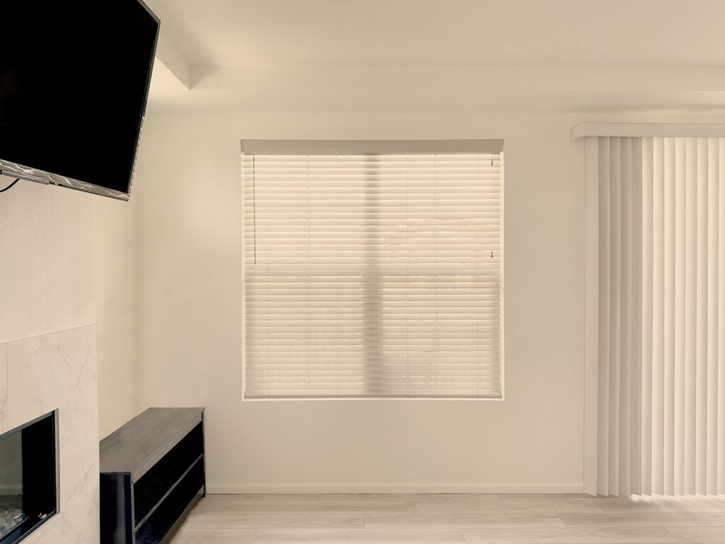 Hunter Douglas Parkland Natural Wood Blinds with cord lock. Paired with Vertical Solutions Vertical Blinds featuring wand control and left stack in Centennial home