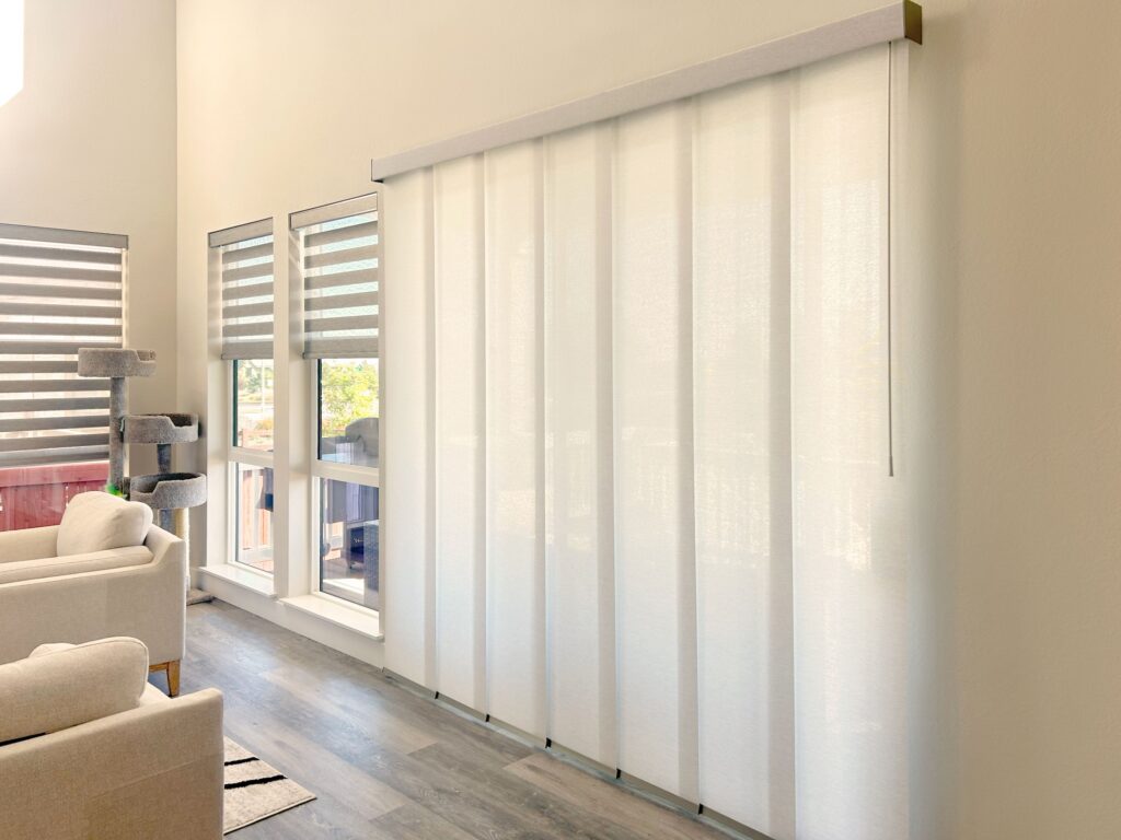 Hunter Douglas Designer Banded Shades with Custom Clutch and Skyline Panel-Track Blinds with Wand Control and light Filtering Fabric for windows and patio doors in Colorado home