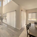 Hunter Douglas Designer Banded Shades and Skyline Panel-Track Blinds for patio door installed in Colorado Home