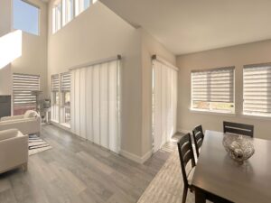 Hunter Douglas Designer Banded Shades and Skyline Panel-Track Blinds for patio door installed in Colorado Home