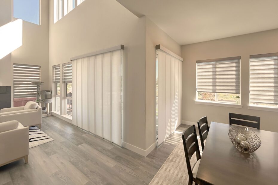 Hunter Douglas Designer Banded Shades and Skyline Panel-Track Blinds for patio door installed in Colorado Home