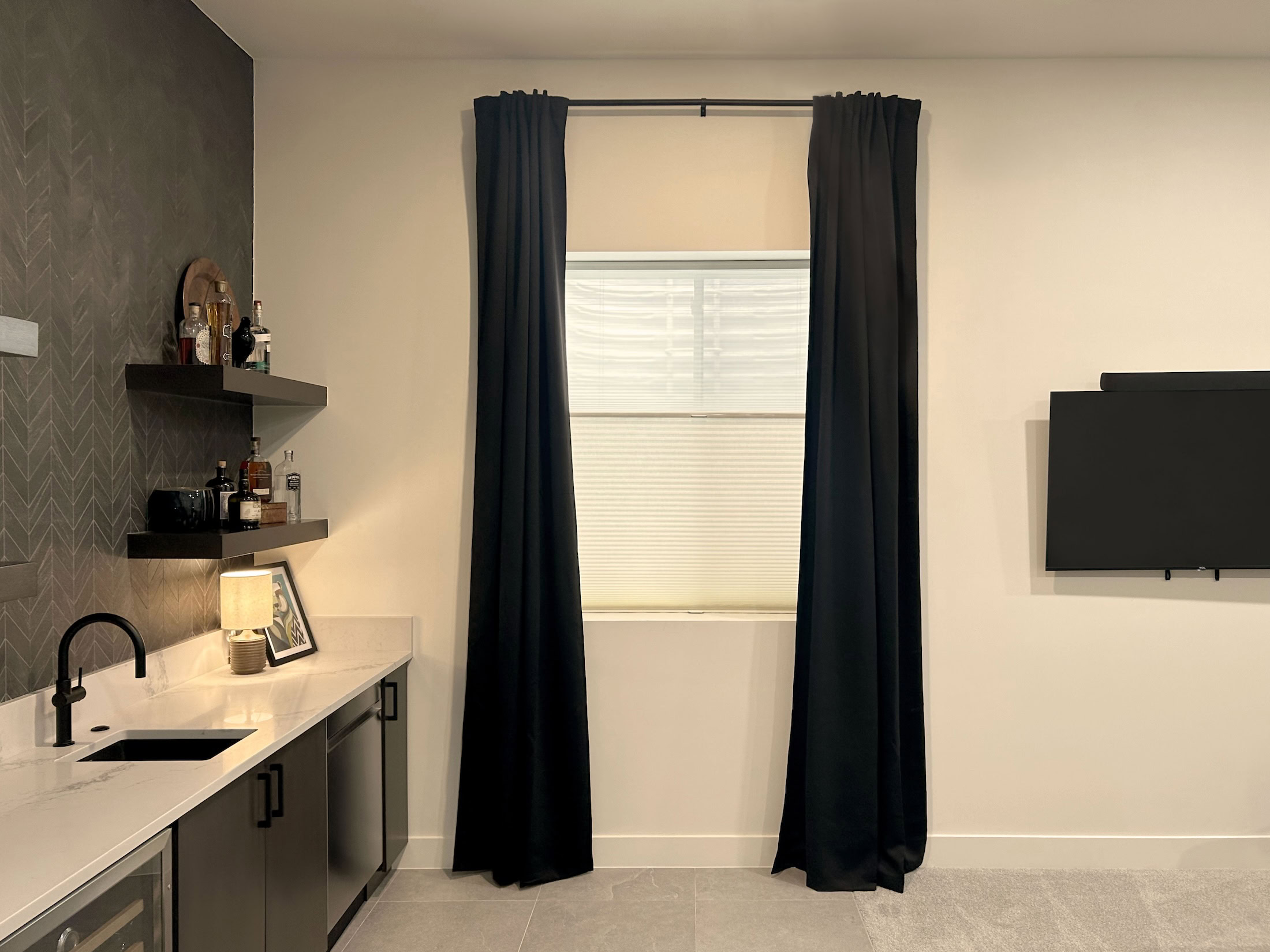 Hunter Douglas Duette® Cellular Shades paired with black curtains