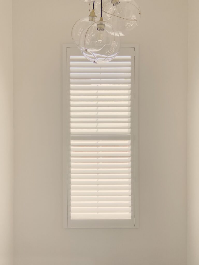 Hunter Douglas Palm Beach Polysatin Shutters with Hidden Tilt operation, part of the Motorized Interior Shutters collection for Lakewood homes