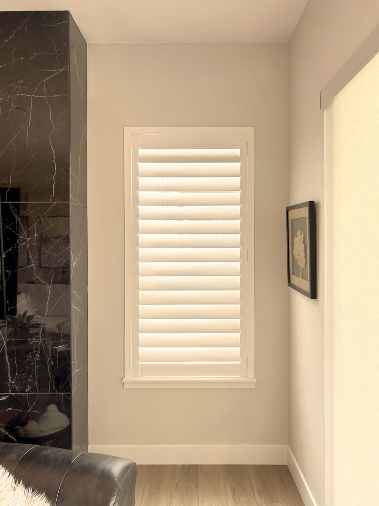 Hunter Douglas NewStyle Hybrid Shutters with Hidden Tilt and L Frame for Castle Rock Home
