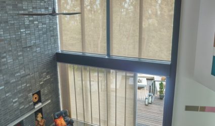 Castle Rock home with motorized vertical blinds on sliding door