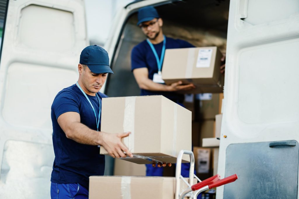 Professional movers loading boxes into a van in Calgary.