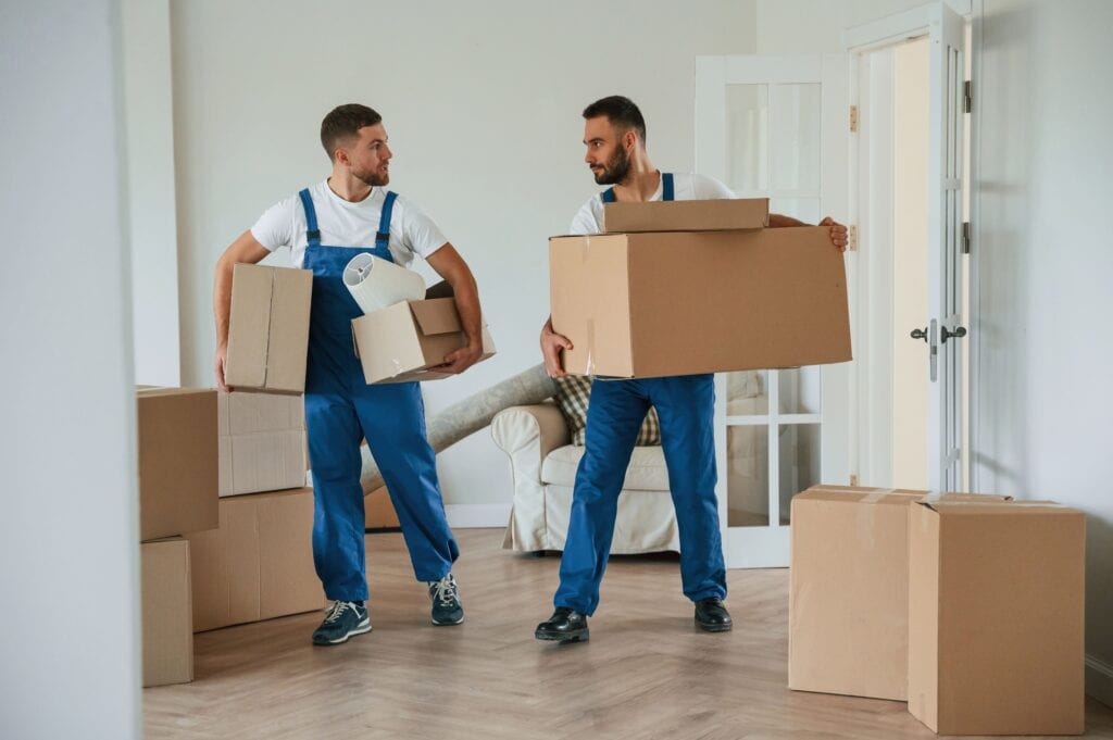 Movers in Chestermere AB packing boxes for a move.