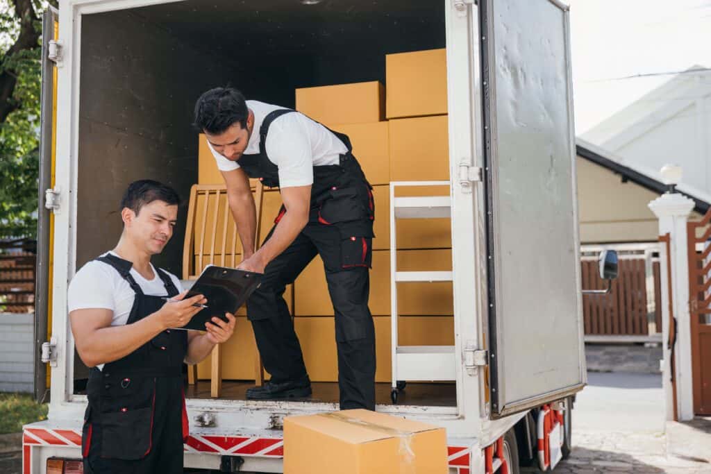 Movers loading boxes into a moving truck in Sylvan Lake.