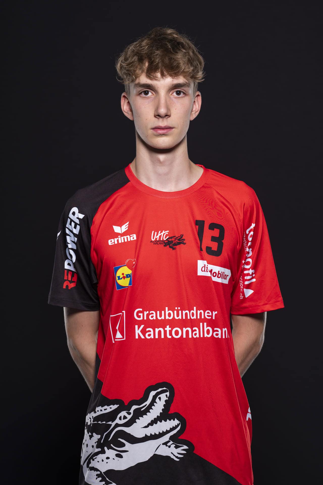 Hochwertiges Jugend-Handballtrikot des UHC Alligator Malans mit Teamlogos und Sponsoren, passend für Fans und Spieler.