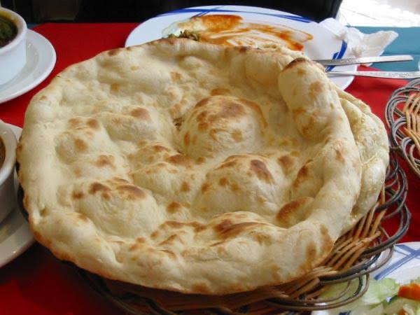 Fresh Plain Naan bread baked in tandoor at Ammonight Restaurant Japan