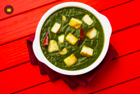 Palak Aloo curry with spinach and potatoes served with naan and rice