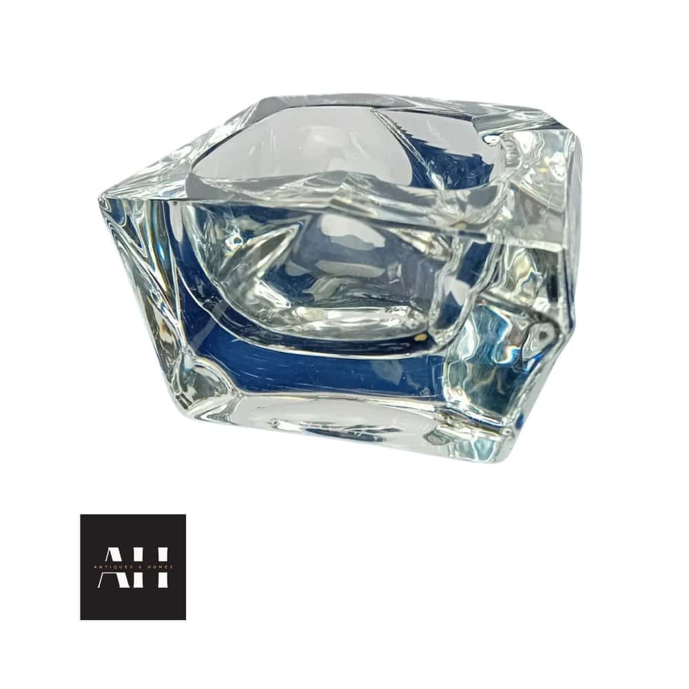 Mid-century Daum Glass crystal ashtray with free-form geometric design, clear crystal finish, and signed “Daum France,” photographed for Antiques and Homes.