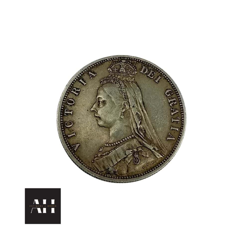Side profile view of 1887 Half Crown coin showing edge detail and sterling silver finish