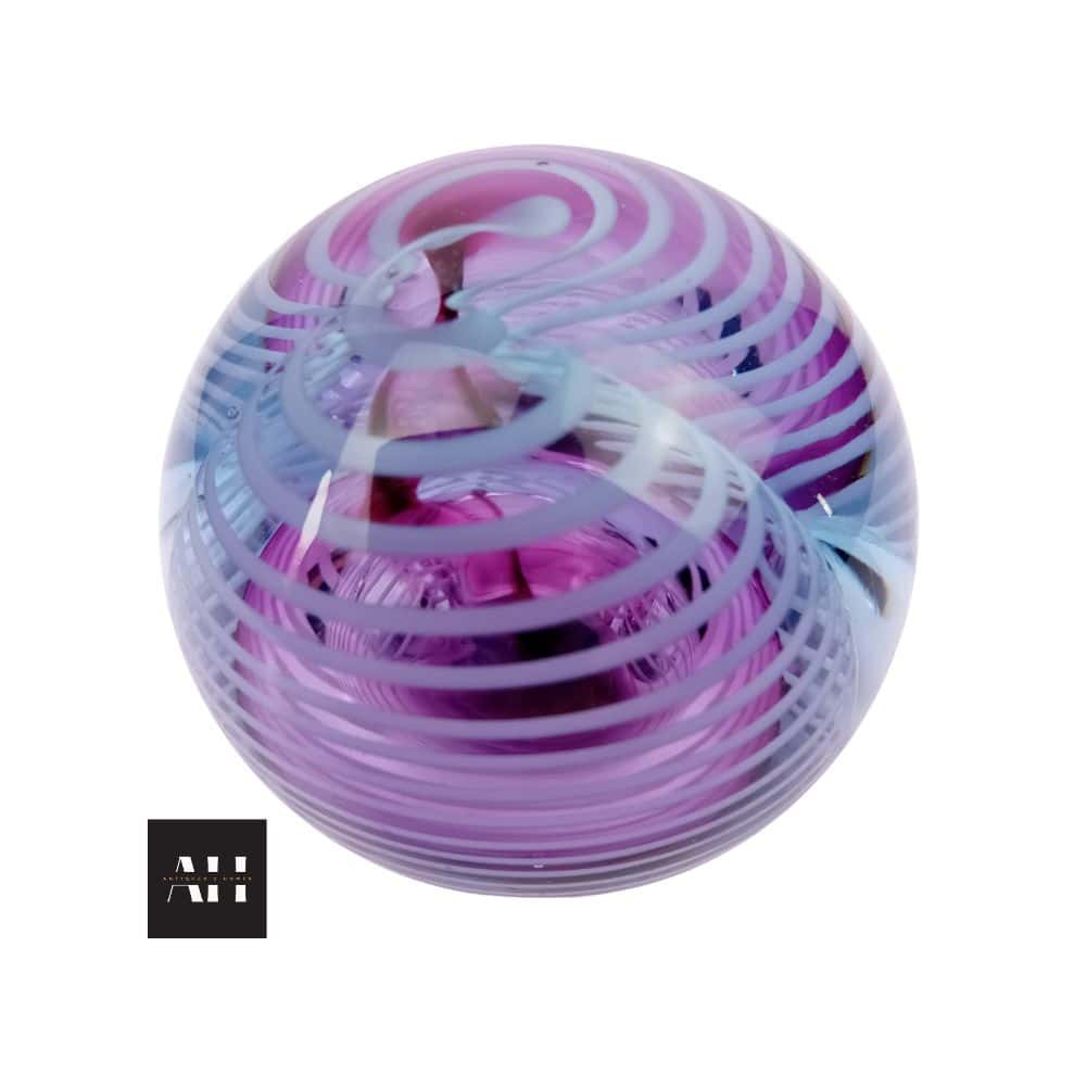 1982 Okra Glass Paperweight by Richard Golding showing purply ruby, blue, and white design with swirling ribbons, handmade British studio glass.