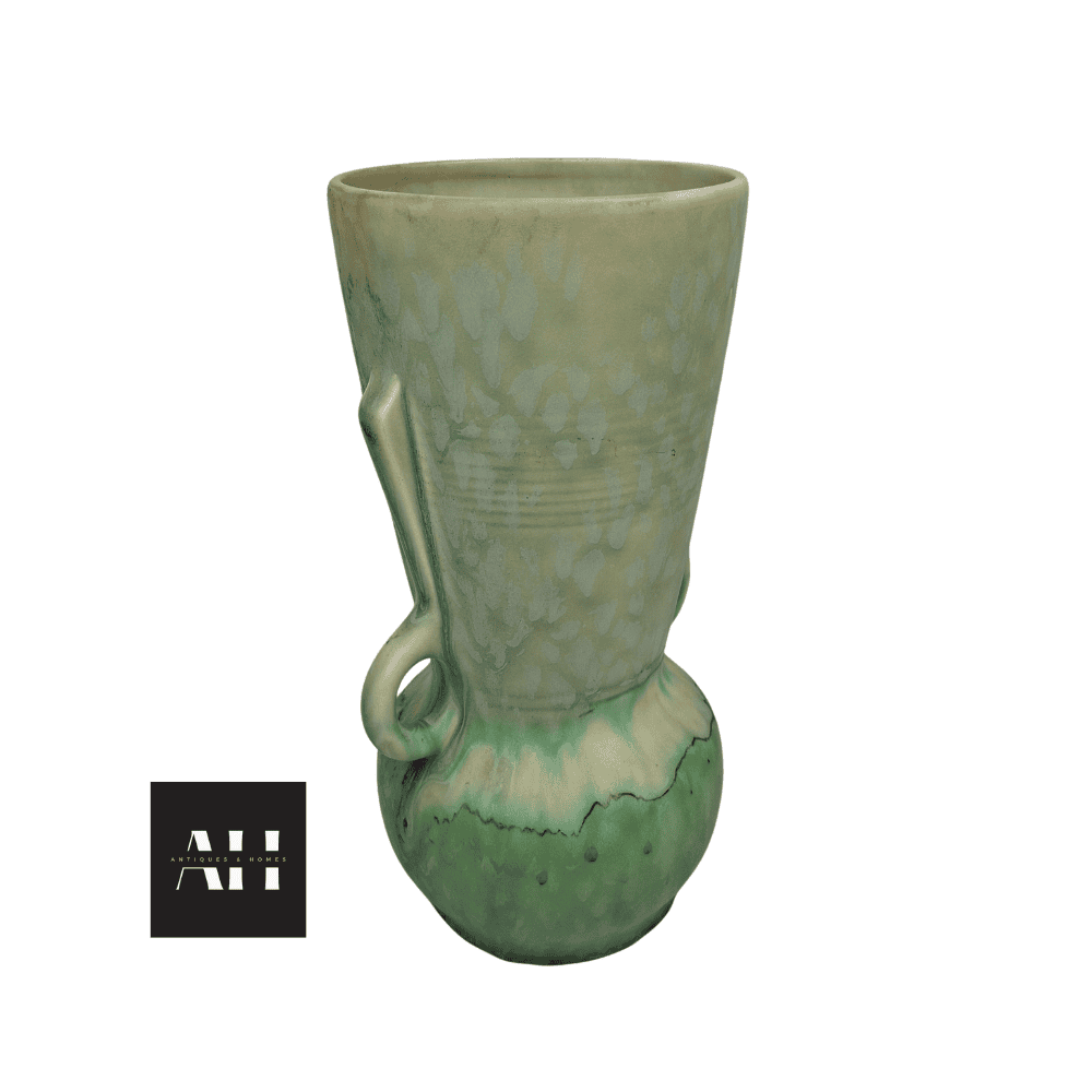 Side profile view of a Beswick Art Deco vase highlighting twin loop handles and tapered sculptural form.