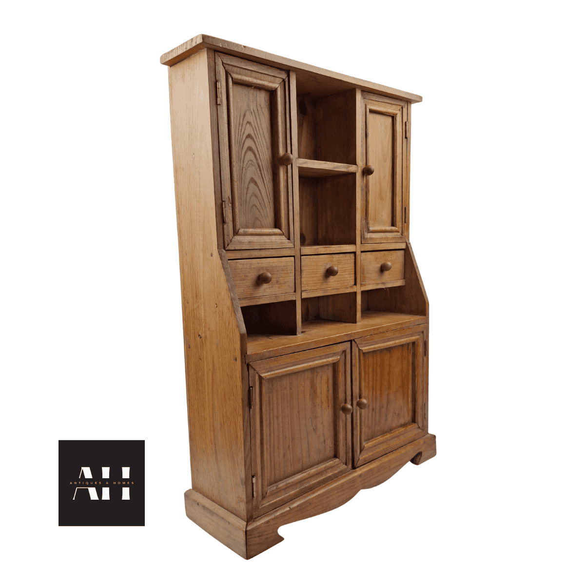 Angled view of a miniature pine dresser showing shelving and drawers in rustic shedwork style.