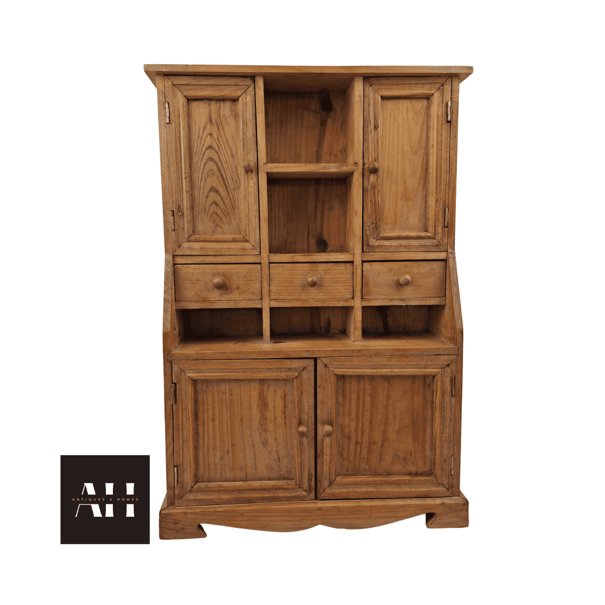 Front view of a shedowrk vintage miniature pine dresser with shelves, drawers and cupboard showing rustic character.
