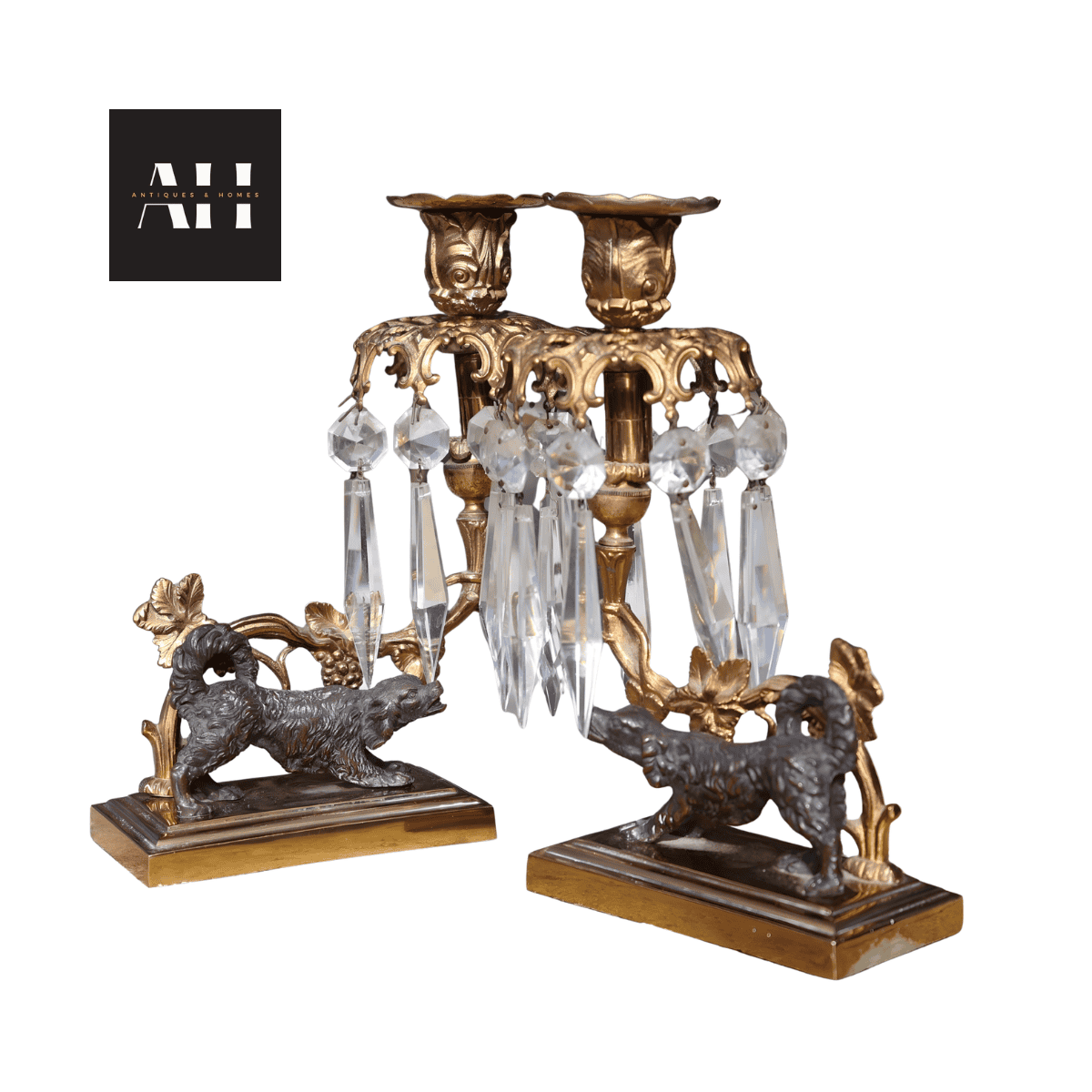 Pair of Antique Gilt Spaniel Candelabra with original glass crystal prisms and dark patinated spaniel bases, late Victorian period