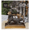 Detailed view of the dark patinated spaniel base on Antique Gilt Spaniel Candelabra showing crisp Victorian casting