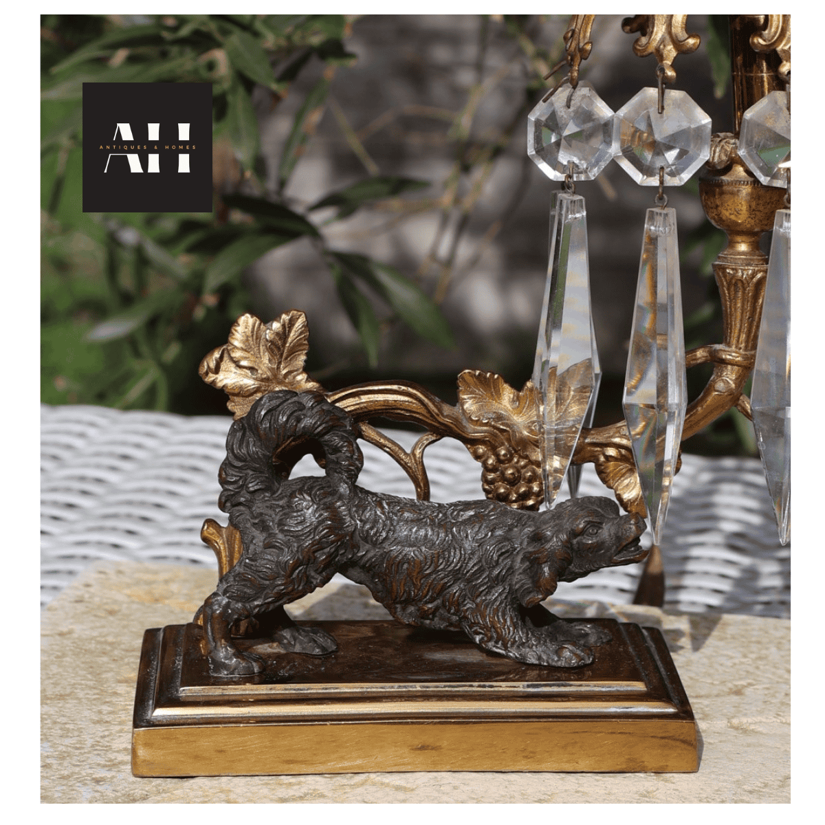 Detailed view of the dark patinated spaniel base on Antique Gilt Spaniel Candelabra showing crisp Victorian casting