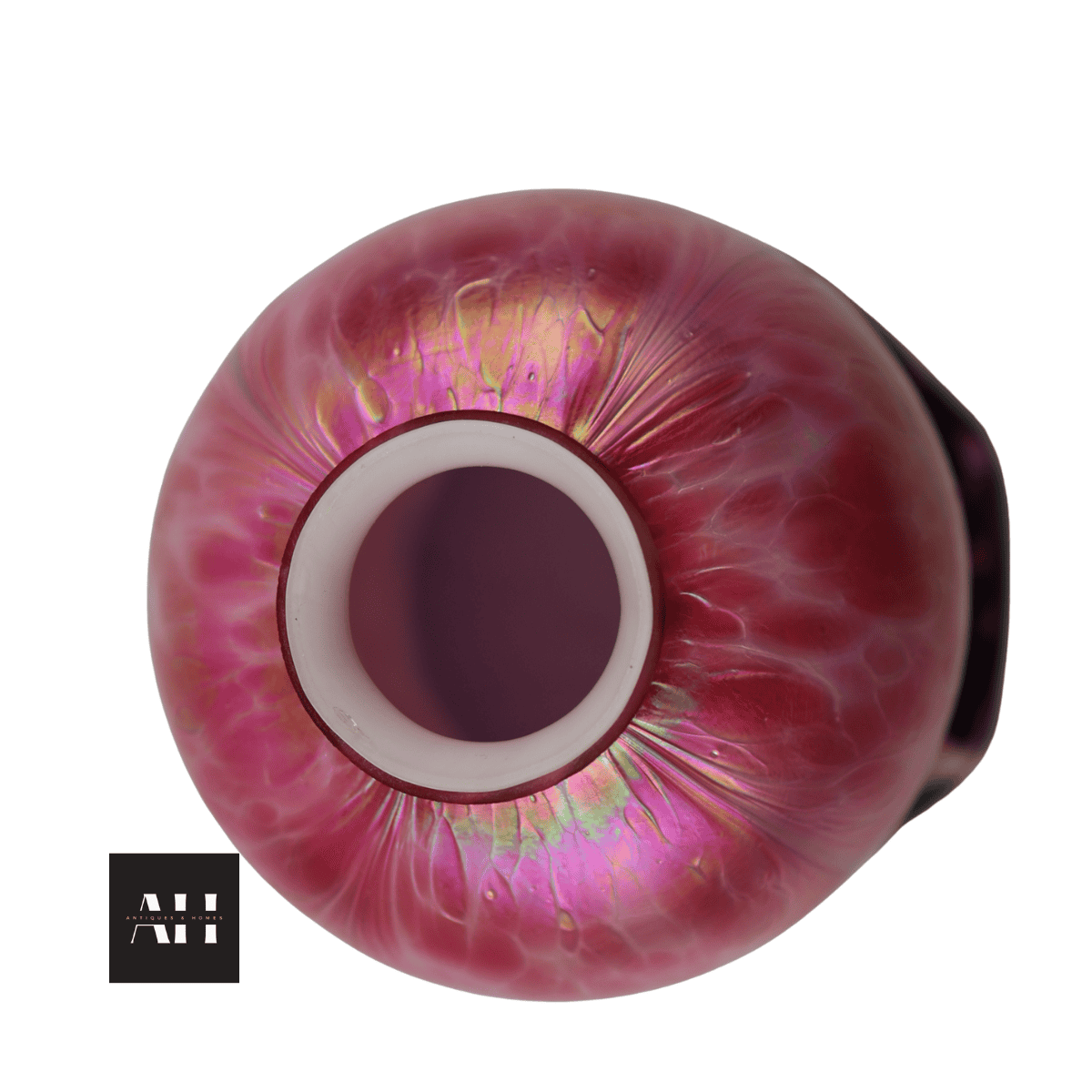 Top opening of Loetz style glass shade showing cased white interior and soft pink iridescent rim