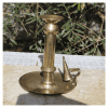 Curved handle detail on Victorian Brass Chamberstick with aged patina