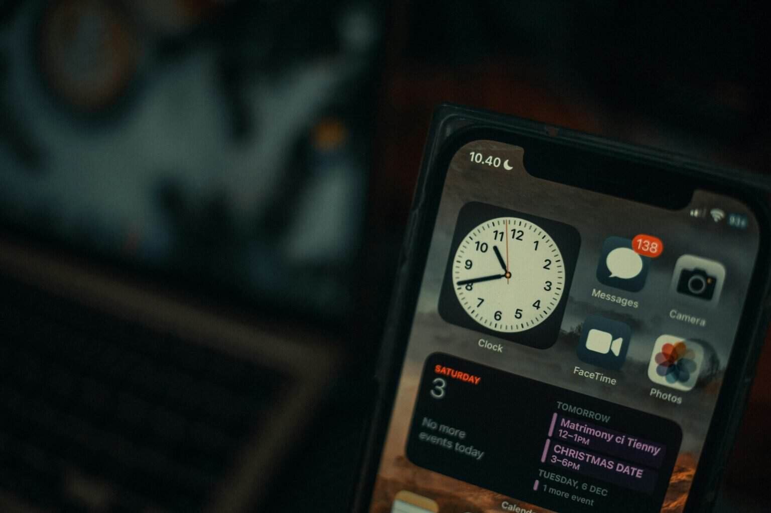 iPhone home screen with productivity apps like Clock, Messages, and Calendar
