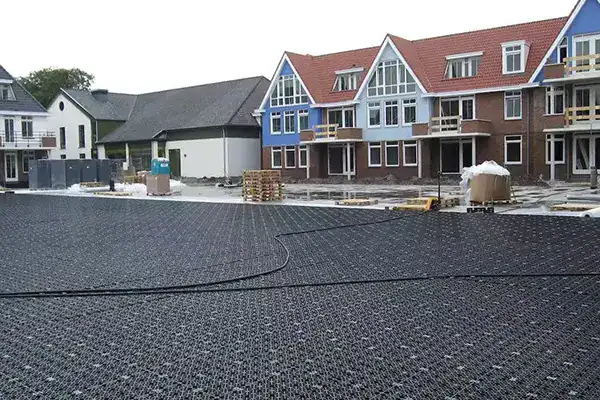Permeable block paving installed over shallow geocellular attenuation tank sub-base for traffic load support