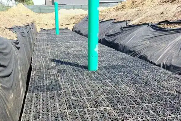 Stormwater system inspection ports and sediment traps for easy maintenance