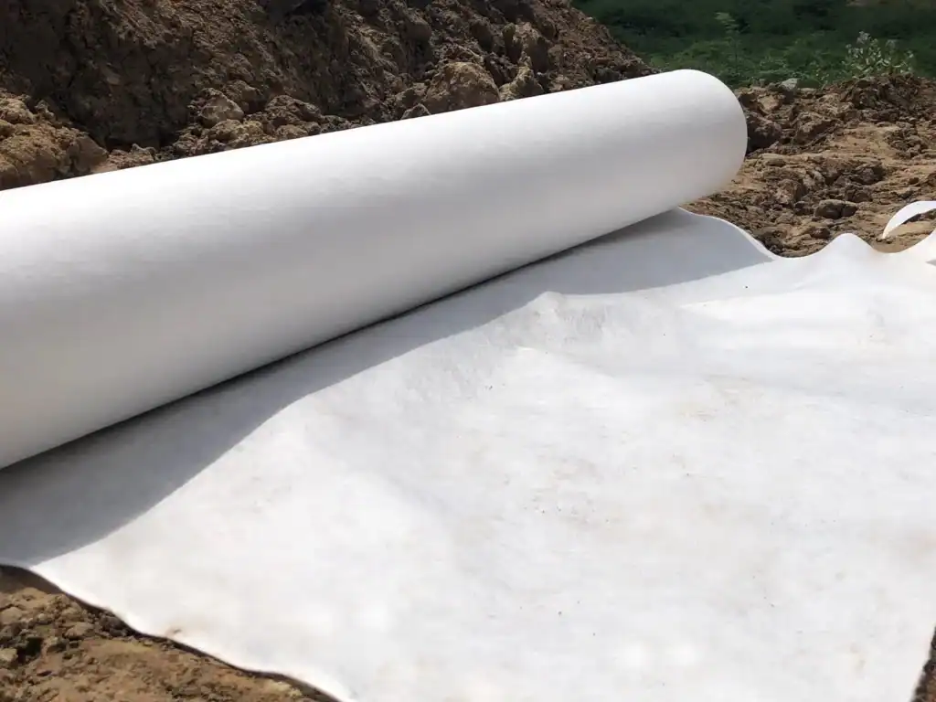 Heavy-duty geotextile under riprap for coastal erosion control and slope protection Heavy-duty geotextile under riprap for coastal erosion control and slope protection