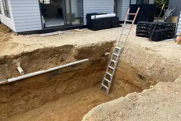 Backyard dry well and septic drain field installation