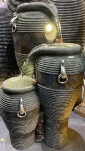 Classic tiered stone water fountain centerpiece for courtyard gardens
