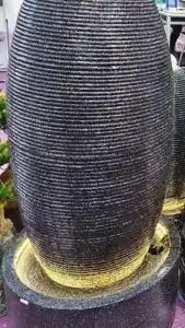 Decorative backyard water fountain creating a soothing soundscape
