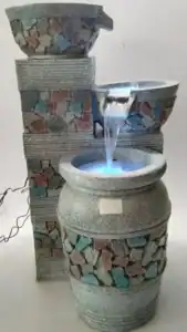 Pedestal garden fountain with cascading water effect
