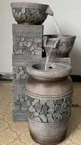 Round basin water fountain with central jet for driveway turnarounds
