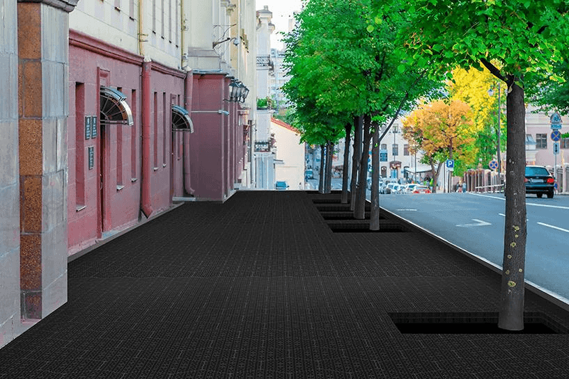 Honeycomb drainage cells installed in urban tree pits to prevent soil compaction and provide root aeration under paved surfaces.