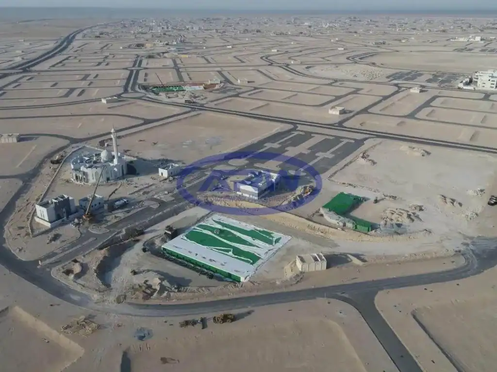 Aerial view of a UAE desert development showing an underground stormwater detention tank installation