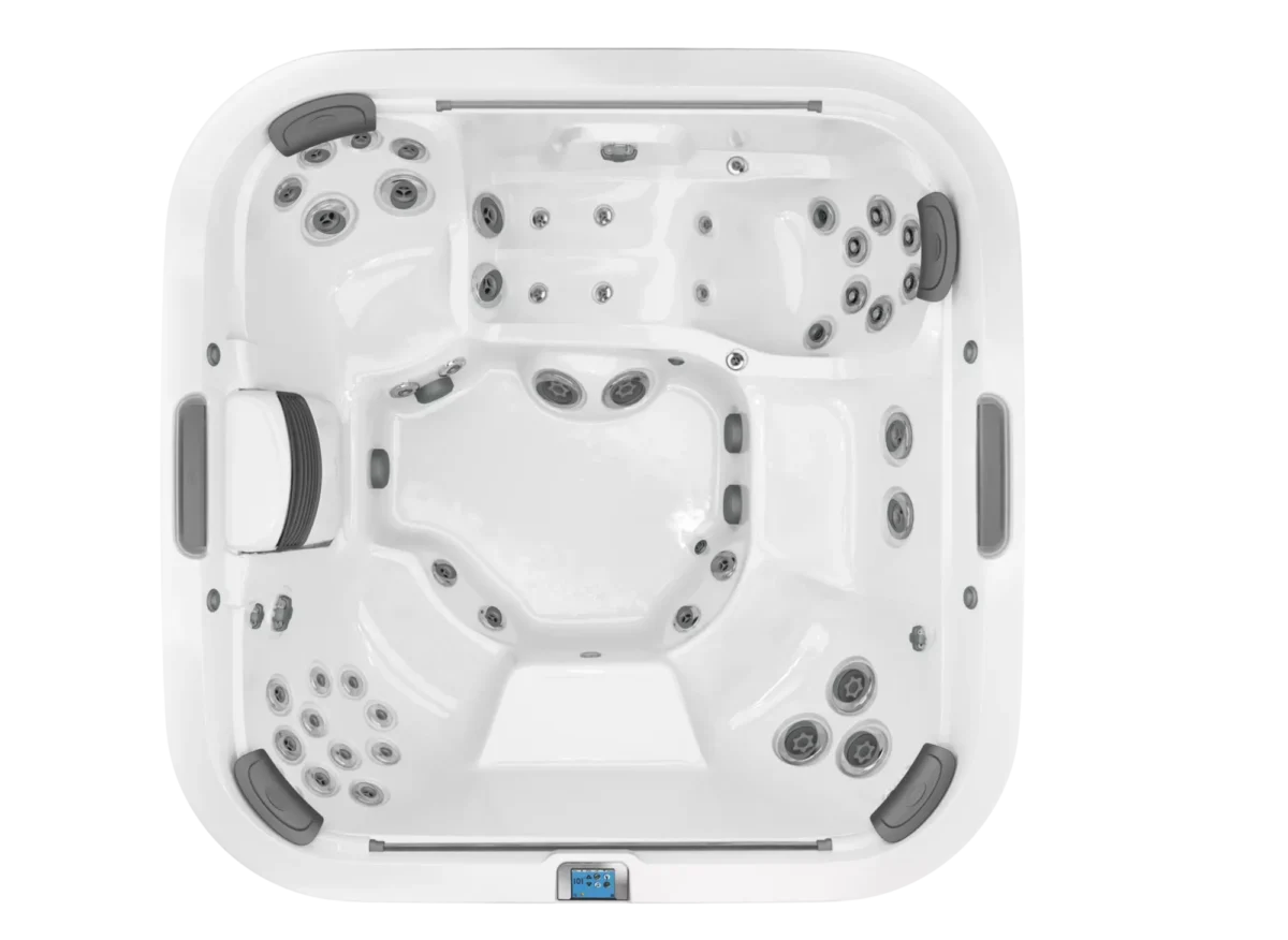 Bovenaanzicht van een grote, witte jacuzzi met jets.