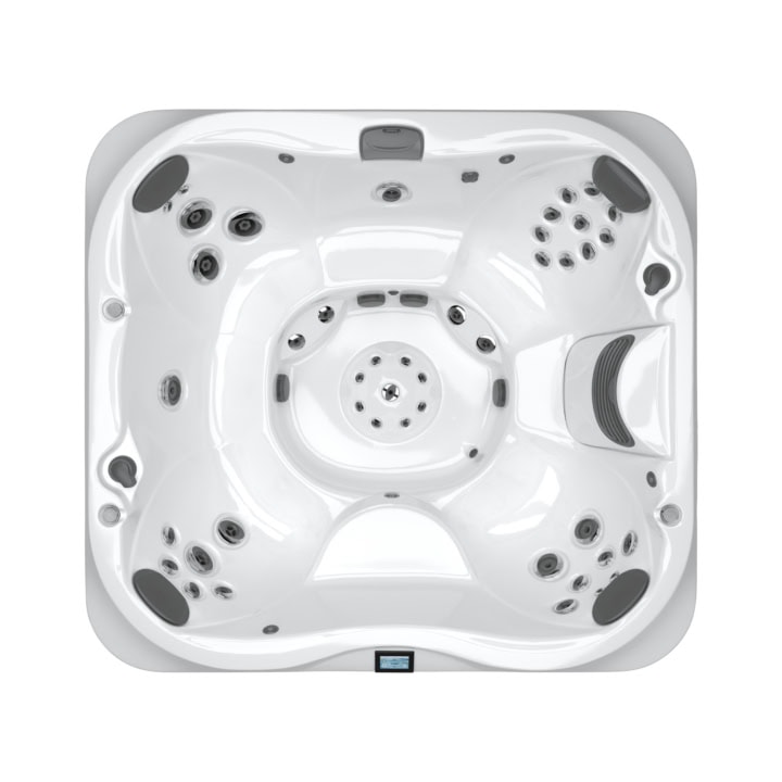 Bovenaanzicht van witte jacuzzi met jets.