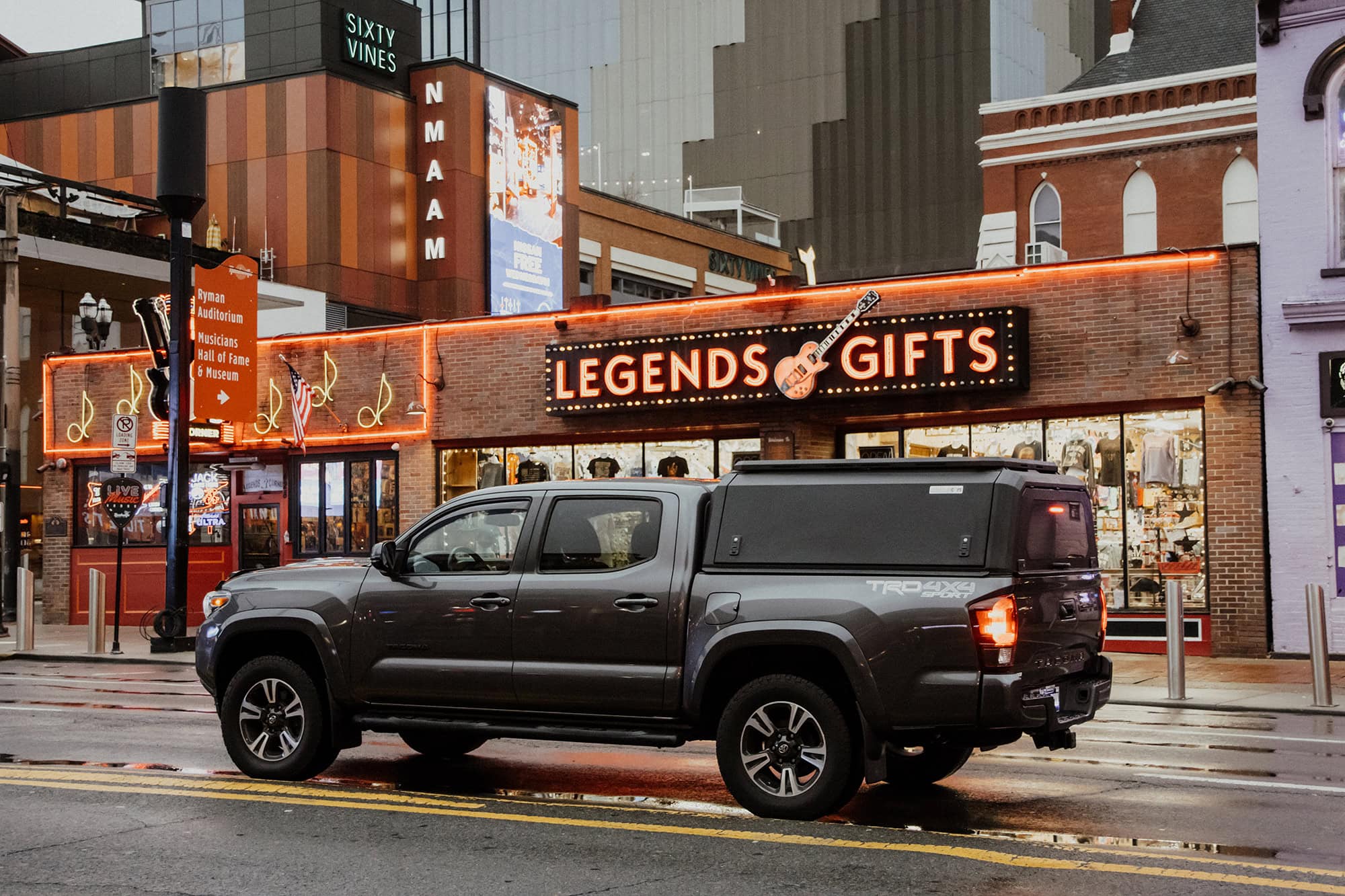 Stainless steel non-modular truck cap with a matte black finish, designed for durability and style, perfect for protecting cargo on pickup trucks.