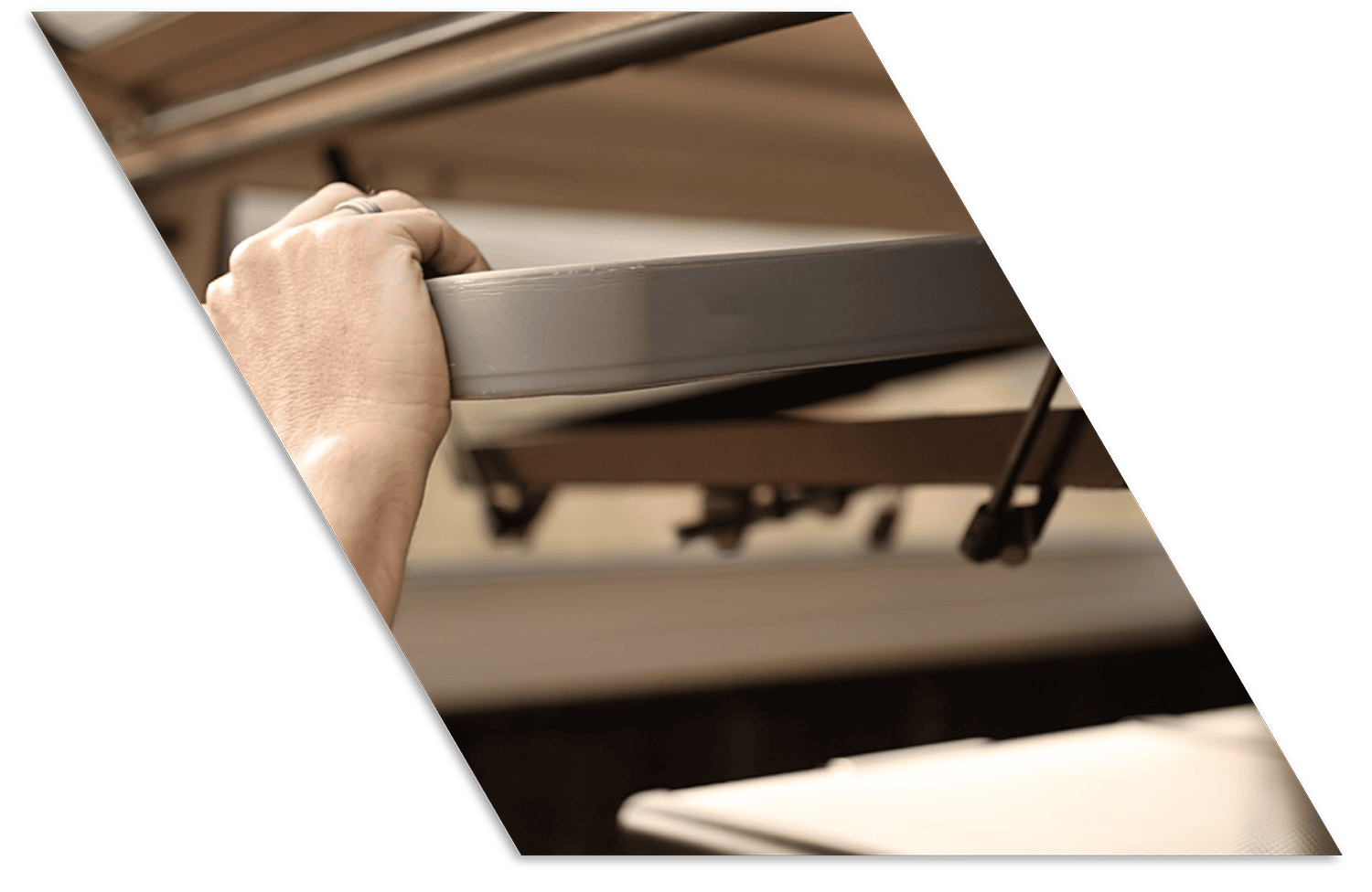 Heavy-duty stainless steel truck cap being installed for durability and truck bed protection.