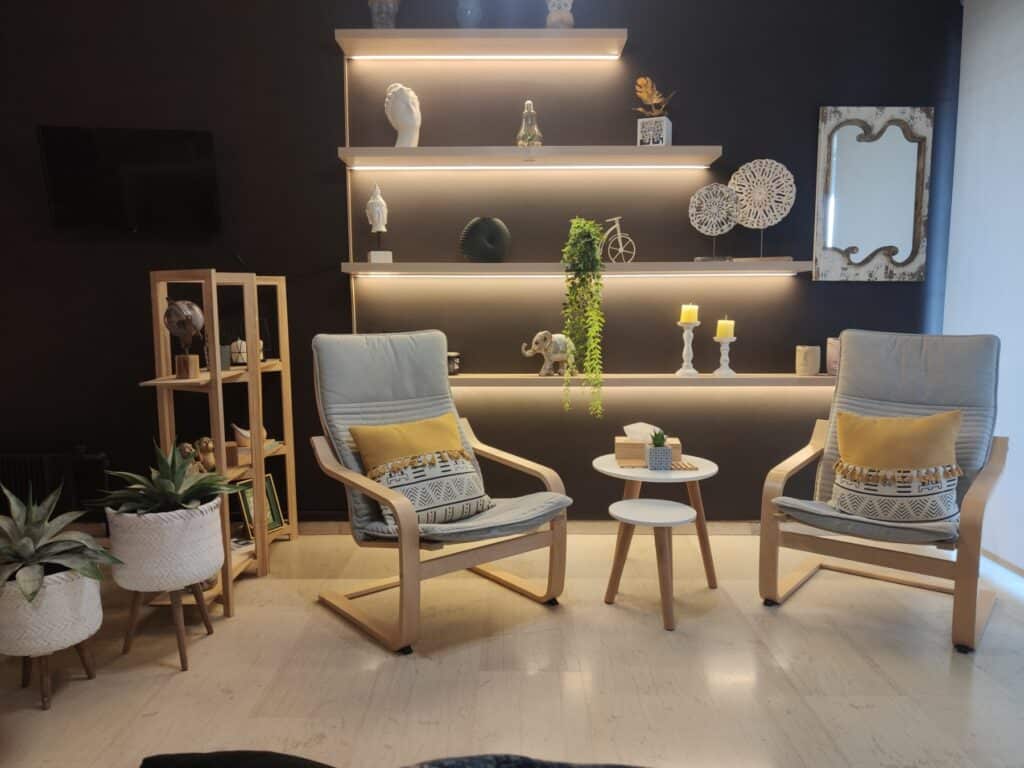Contact 1 The interior of the Art of Mind psychotherapy center in Patras, Greece, showcasing a serene office environment designed for therapeutic sessions led by Matina Ladikou.