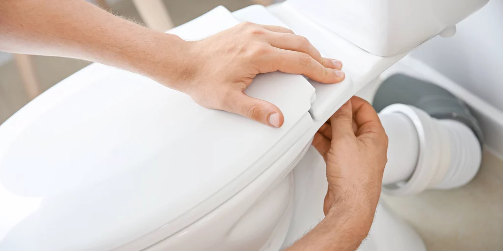 plumber-fixing-a-toilet