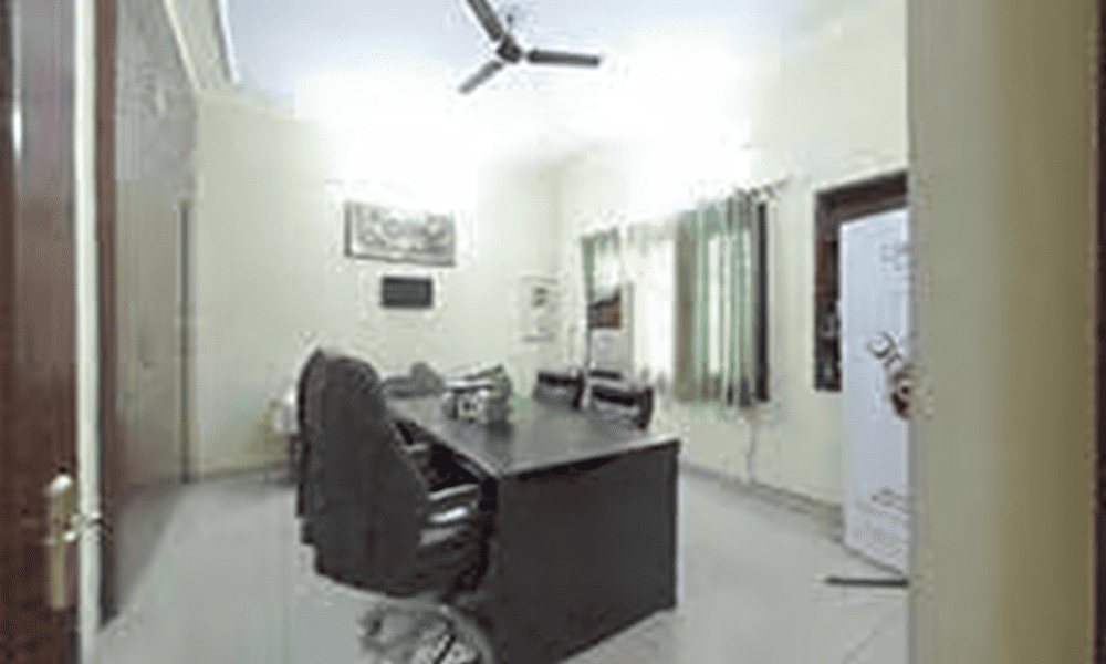 Office room at ASG Hair Transplant Centre with consultation table and chairs for patient advisory.