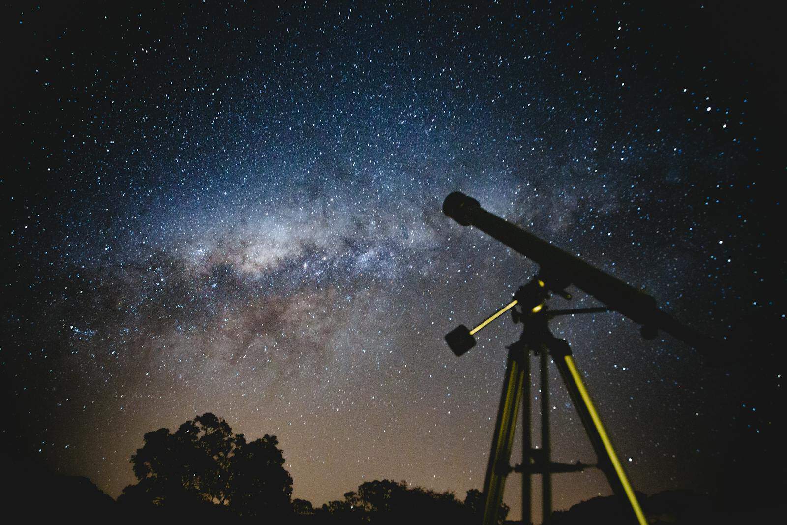 Astrological Houses, Stunning starry sky with silhouette of telescope capturing the Milky Way in Brazil.