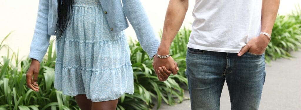 a man and a woman holding hands walking down a sidewalk, Kundali Love Matches, Horoscope, Astrology, Natal Chart, Birth Chart, Celestial Guidance