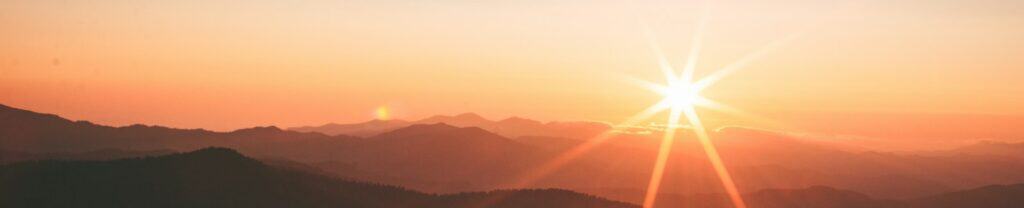 silhoutte of mountains during sunset